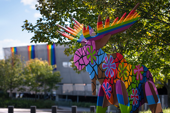 Picture of a rainbow moose made in wood