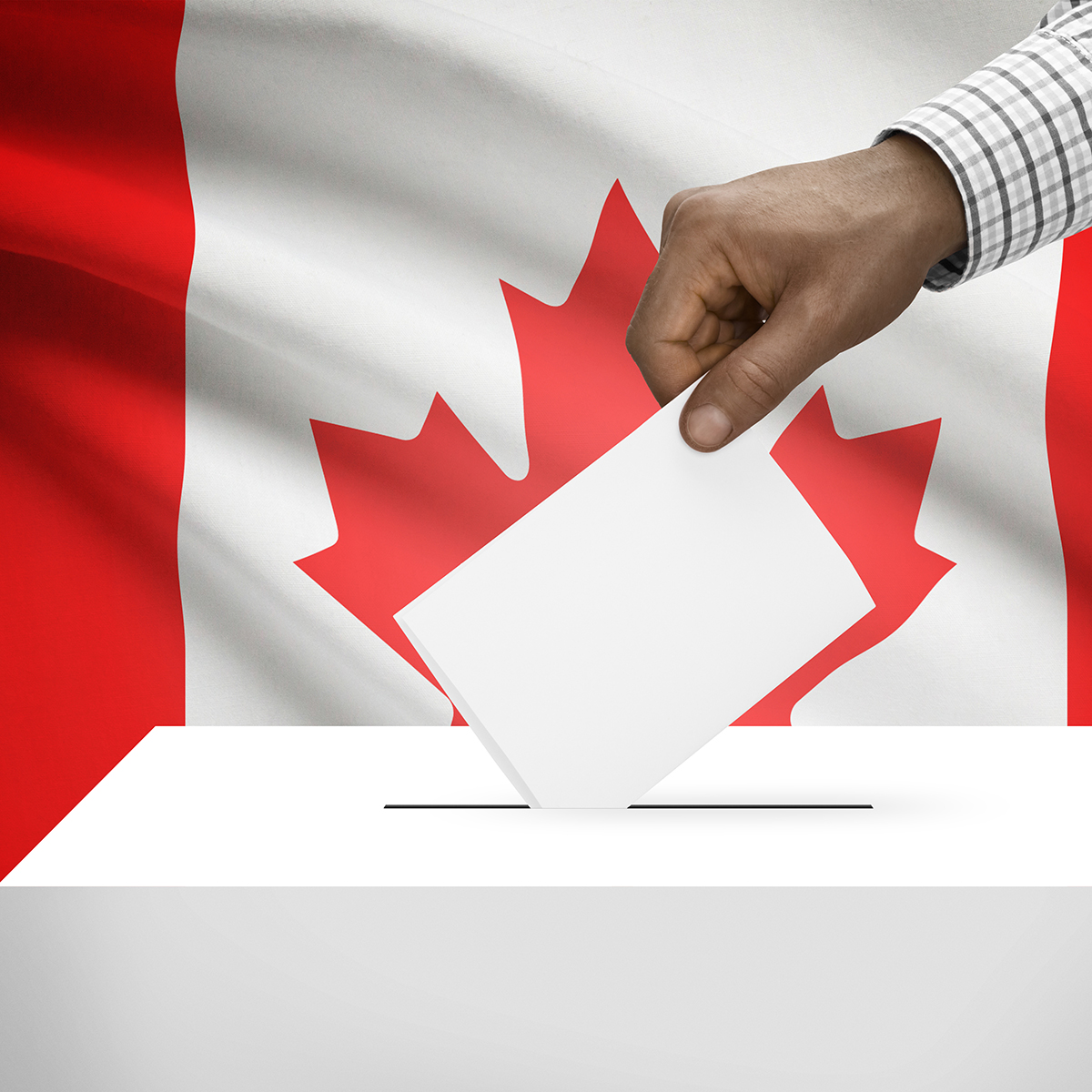 A hand holding a voting card and dropping it in a ballot box, with the Canada flag in background.